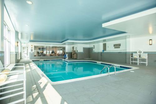 a large swimming pool in a large house at DoubleTree by Hilton Asheville Downtown in Asheville