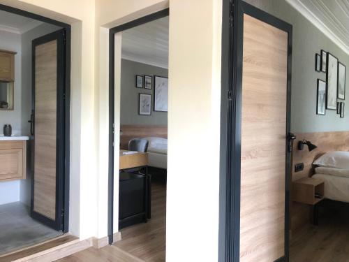 a room with a sliding door with a bedroom at Drive Point (Adventure Lake Resort) in Asparukhovo