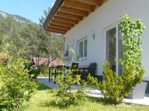 a view of the house from the garden at Apart Lechtraum in Stanzach