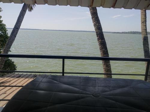 a view of the water from the porch of a boat at SANTA MARIA HOSTEL MUNROE ISLAND in Munroe Island