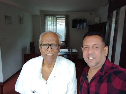 two men standing next to each other in a room at Vino Villa Tourists & Local Accommodations - 24 Hrs in Kandy