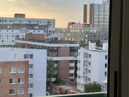 a view of a city skyline with tall buildings at Belle Chambre a EVRY proche Gare RER in Évry-les-Châteaux