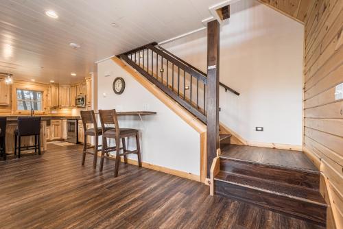 a kitchen and dining room with a staircase in a house at Moon and Stars in McHenry