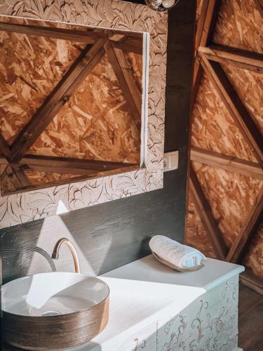 a bathroom with a sink and a mirror at Bubble Suites in Canyelles