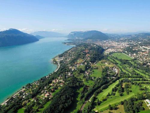 an aerial view of a city next to a body of water at Studio Esplanade bord du Lac in Aix-les-Bains