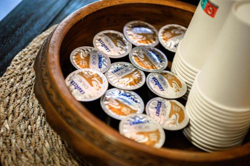 a basket full of cups and plates on a table at Къща ЕТНО in Koprivshtitsa
