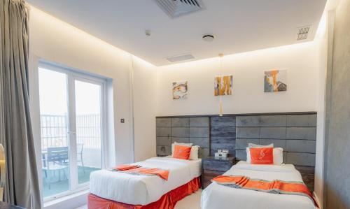 Katil atau katil-katil dalam bilik di Wahaj Hotel Apartments 2