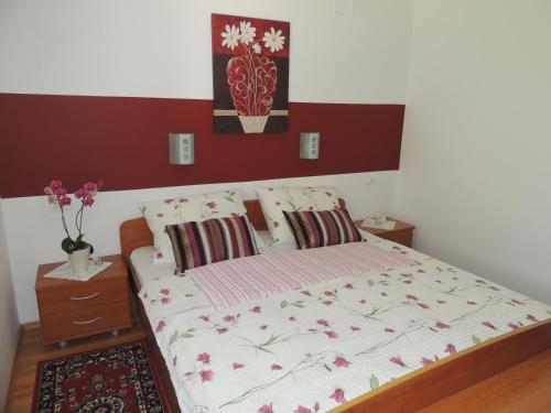 a bedroom with a large bed with at Apartments and Rooms Tavcar in Bled