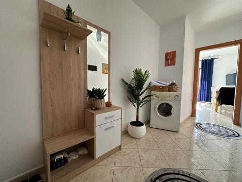 a laundry room with a washer and a washing machine at Amazing Paradise Sensation 2 Bedroom Luxury Apartment with a Jacuzzi in Durrës