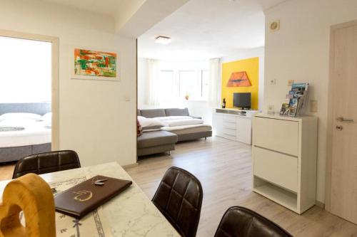 a kitchen and living room with a table and chairs at Appartements Fam. Gleinser Mirella in Neustift im Stubaital
