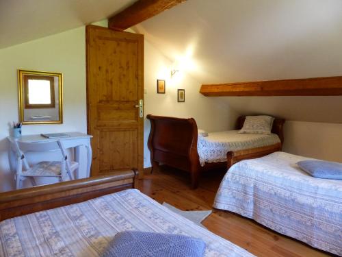 Un pat sau paturi într-o cameră la Gite d'Appy