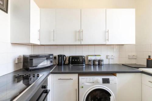 Η κουζίνα ή μικρή κουζίνα στο Stunning 1 bed flat in the heart of Greenwich