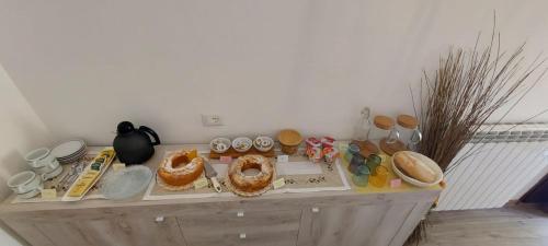 a table with food and other items on it at B & B Giu & Dany in Bruscoli