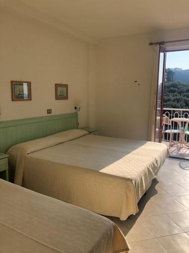 Postel nebo postele na pokoji v ubytování Hotel Dania