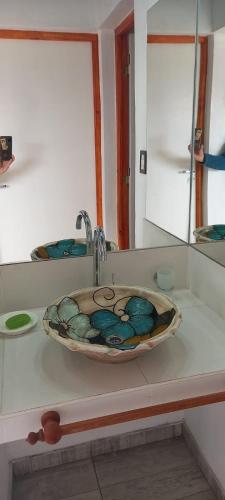 a bathroom counter with a sink and a sink at Al Paraíso in Tafí del Valle