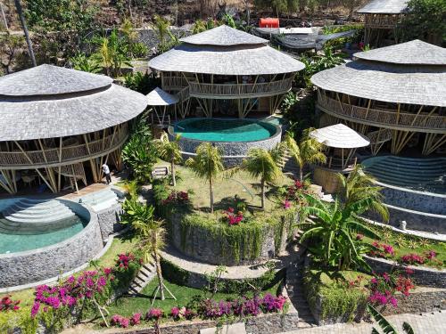 an aerial view of a resort with a swimming pool at Villas Bukit Lipah in Amed