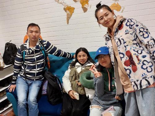 a group of people sitting on a couch at Hostel.Uz in Samarkand