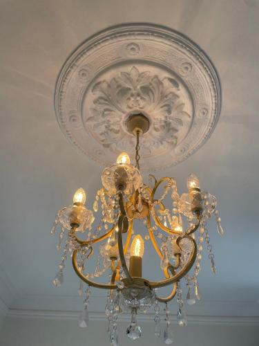 a chandelier hanging from a ceiling at Villa Eckhoff in Stavanger