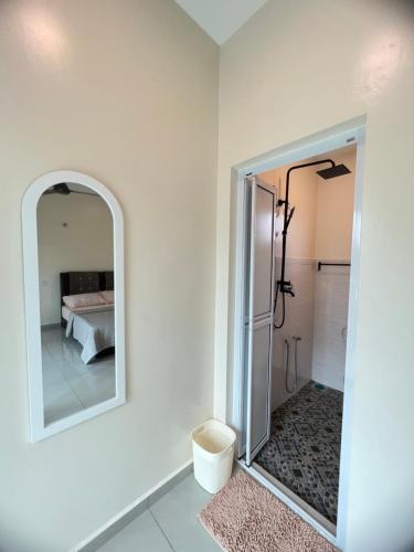 a white bathroom with a mirror and a bed at AA SWEET ROOM TANJUNG BIDARA MELAKA in Masjid Tanah
