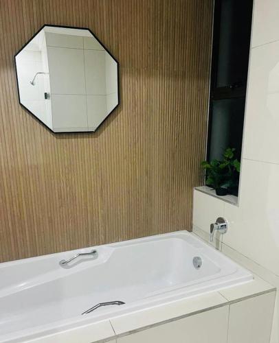 a bathroom with a white sink and a mirror at Seaview Sanctuary in Durban