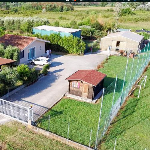 an aerial view of a house with a fence at Vinciguerra Central House Tuscany in Altopascio