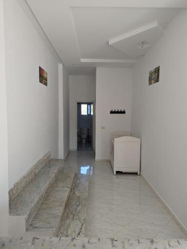 a room with white walls and a marble floor at NN Residence Tabarka in Tabarka