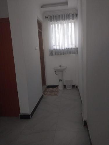 a bathroom with a sink and a toilet in a room at White House Resort 