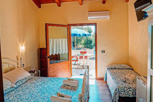 Ένα ή περισσότερα κρεβάτια σε δωμάτιο στο Agriturismo Rocce Bianche