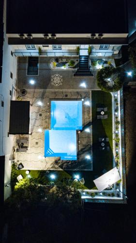 an overhead view of a swimming pool at night at Maison de Julia Pompei in Pompei