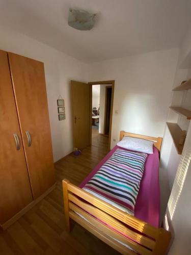 a bedroom with a bed in a room at Apartman Željo in Livno