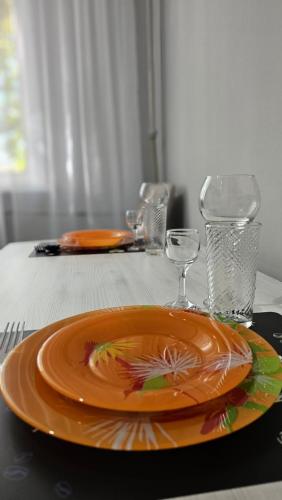 an orange plate sitting on top of a table at 1 комн. квартира центр in Semey