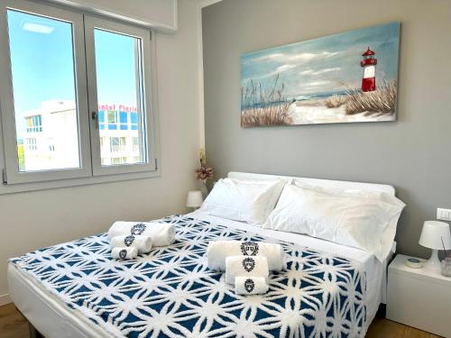 Ένα ή περισσότερα κρεβάτια σε δωμάτιο στο Beach Front Apartment Sabbiadoro