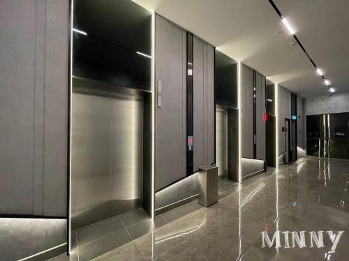a hallway of a building with a glass wall at Netizen Balcony View MRT 4-5pax #17 in Cheras
