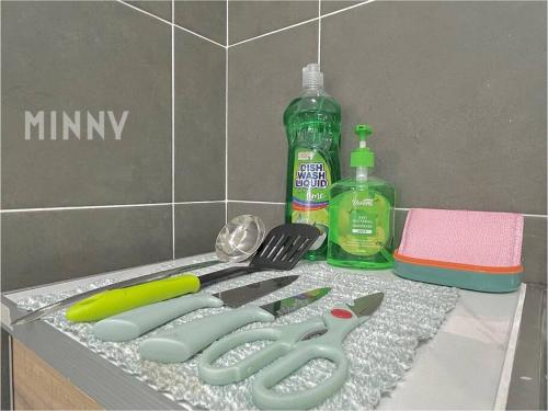 a group of kitchen utensils sitting on a counter at Netizen Balcony View MRT 4-5pax #17 in Cheras