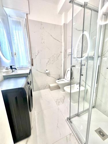 a bathroom with a shower and a toilet at City life Arsenale in Verona