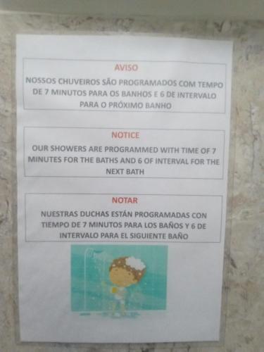 a sign on a wall that saysyssosiuses submersibles at Hostel Maktub in Sao Paulo