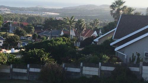 a view of a neighborhood with houses and a fence at Oceanview in East London