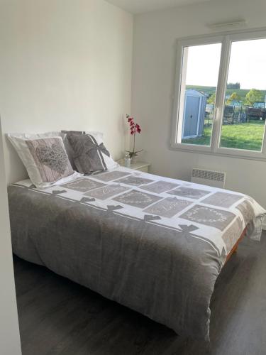 Postel nebo postele na pokoji v ubytování Le gîte de Charlotte