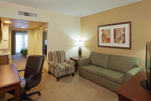 a living room with a couch and a chair at Country Inn & Suites by Radisson, Mesa, AZ in Mesa