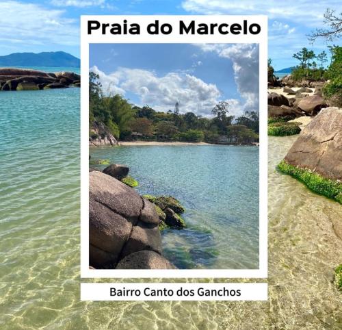 a beach in the middle of a body of water at AP número 3 in Governador Celso Ramos