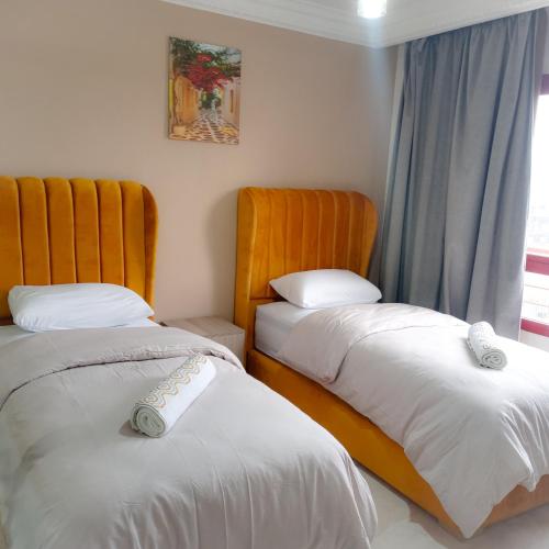 Кровать или кровати в номере Moderne Appartement au plein Centre-Ville en Face Hilton