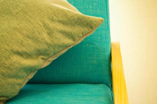 a close up of a pillow on a bed at Alberca, Playa Cercana & Club de Playa opcional -Departamento E13D302 in Gallinero