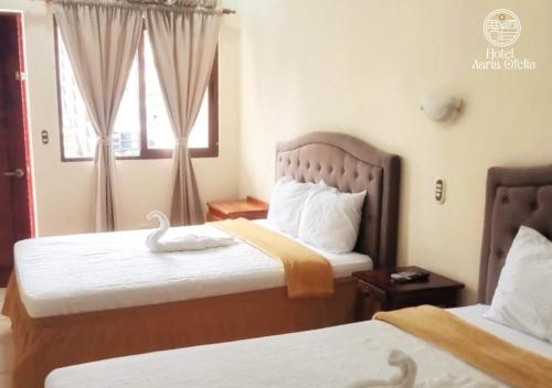 Una cama o camas en una habitación de Hotel y Restaurante Maria Ofelia