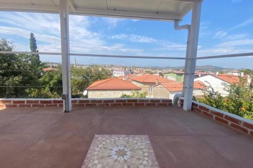 a large patio with a view of the city at Urla Casa Bianca in Urla