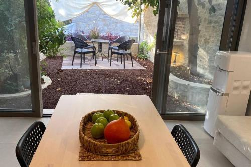 a basket of fruit on a table in a room at Urla Casa Bianca in Urla