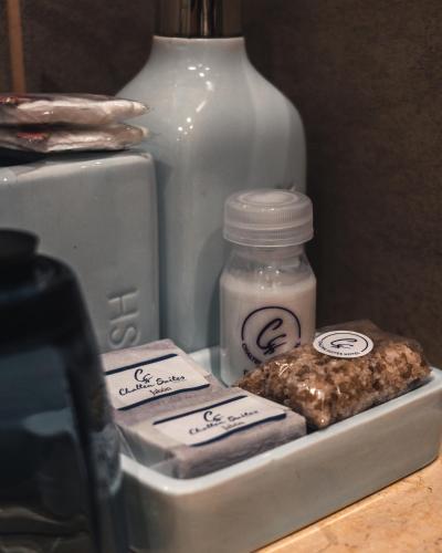 a refrigerator with some food and a jar and a vase at Chalten Suites Hotel in El Chalten