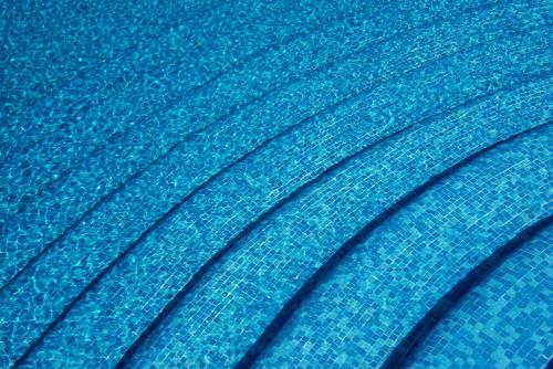 a close up of a blue bedsheet at Alberca, Playa Cercana & Club de Playa opcional -Departamento E13D302 in Gallinero