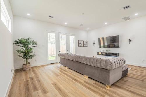 a large living room with a large couch in it at Luxury Home Near Houston Downtown & Medical Center in Houston