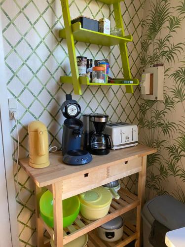 a wooden shelf with a coffee maker on it at Grand Gîte à 25 minutes du Puy Du Fou in Montournais