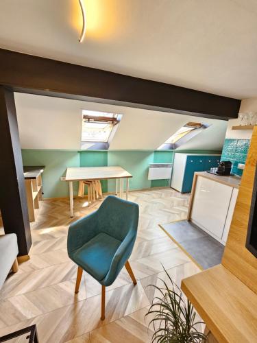 a living room with a table and a chair at Booking Apartment Rajiceva in Belgrade